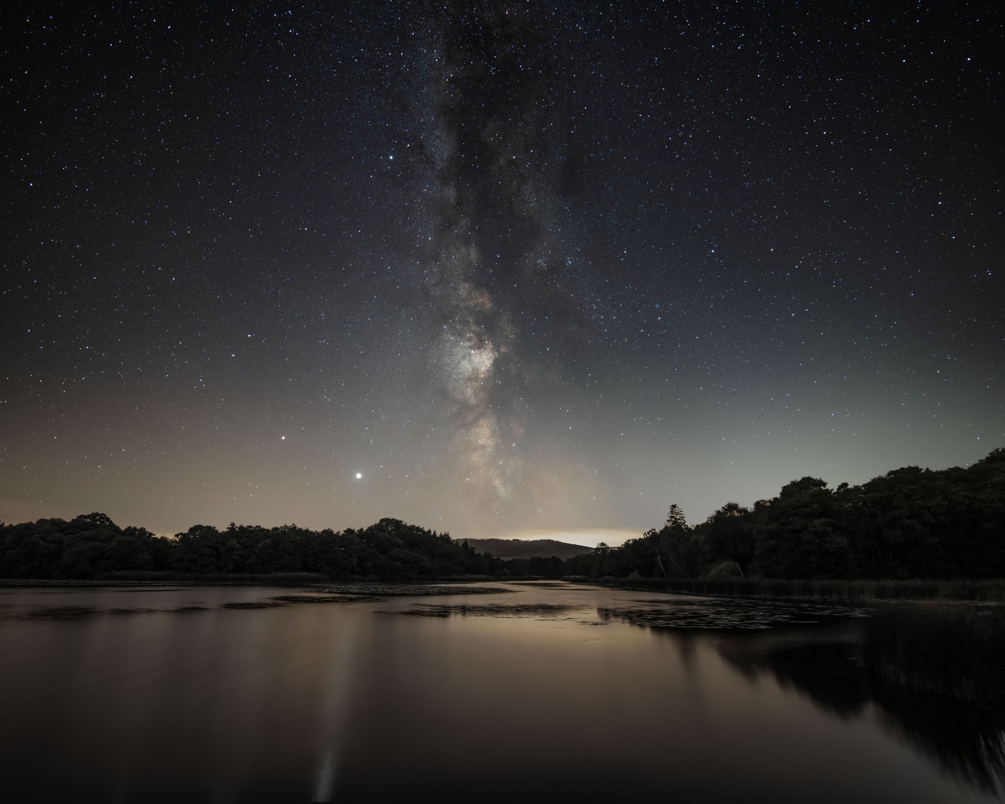 The dazzling Milky Way galaxy taken from Mill Pond in the South Downs National Park