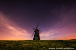 Dark Skies category winner in South Downs National Park Photo Competition 2015-16 Piers captured his dark-sky winning photo on the night of the total lunar eclipse in September 2015. As he waited for the blood moon to rise he noticed how the light pollution sandwiched the small hill but left the sky above the windmill in darkness.