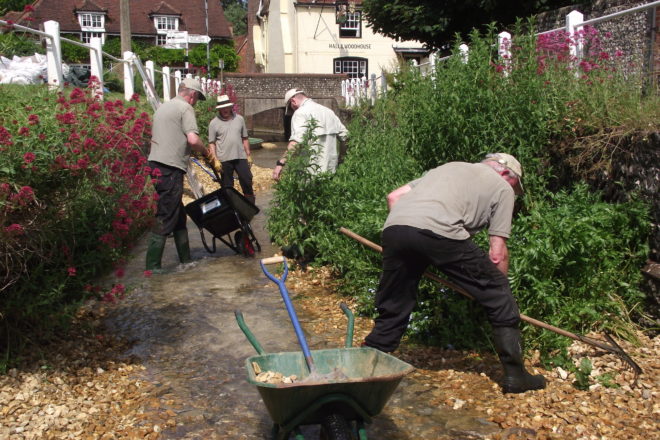 Image showing volunteers clearing the path of the River Meon in East Meon