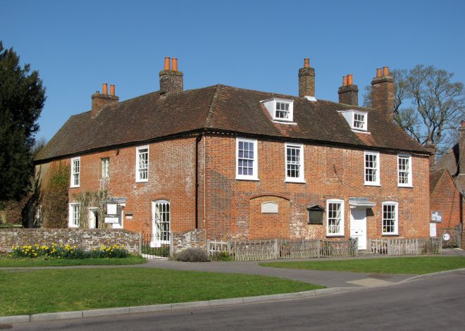 Jane Austen's House in Chawton with a row of yellow daffodils out in front